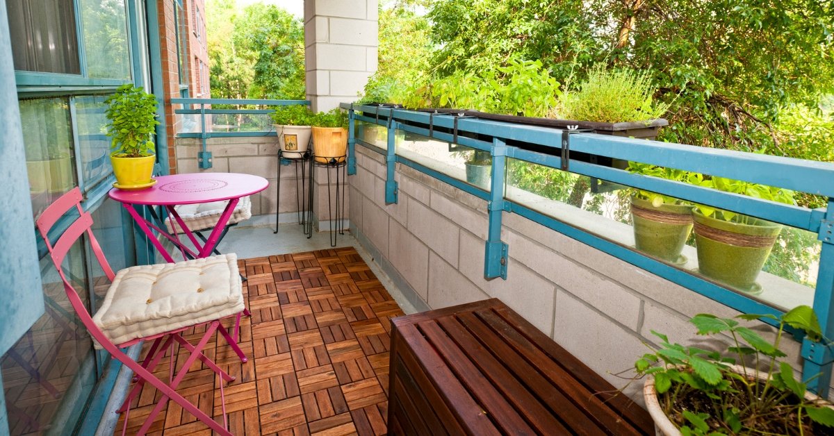 small apartment balcony with many plants but open walking space